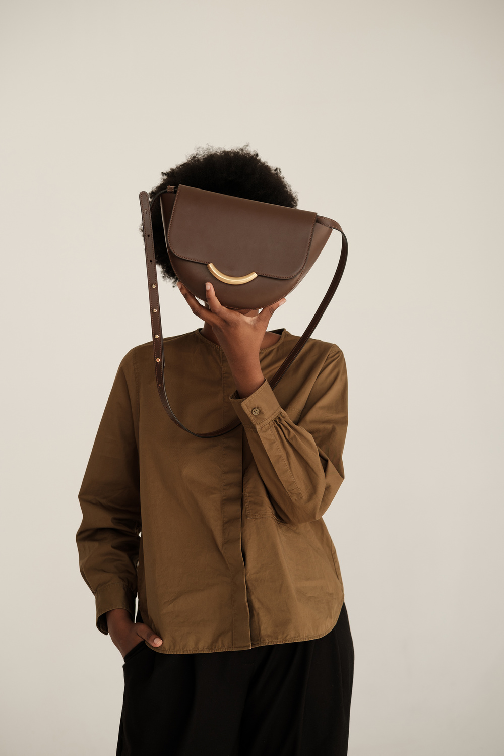Woman in Casual Shirt with Handbag